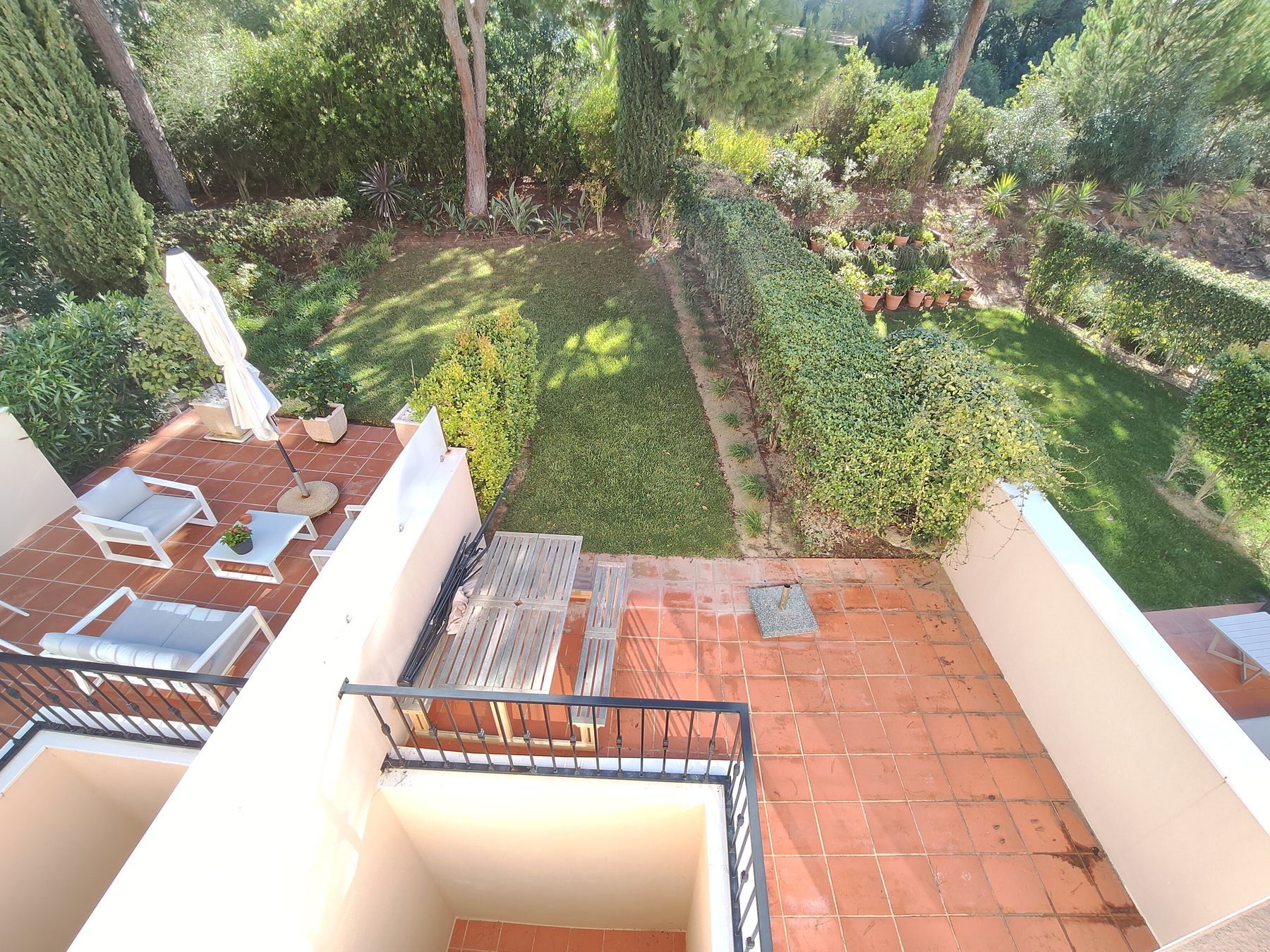 Palmyra, Vila Sol — private terrace overlooking the communal gardens