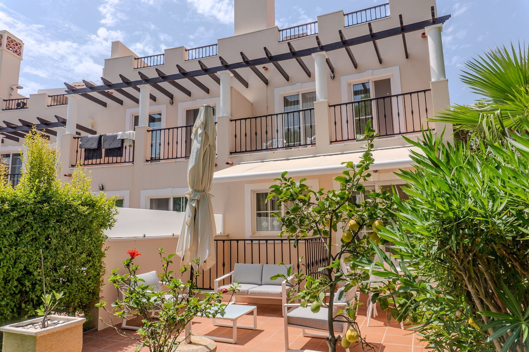 Vila Sol end-terrace, Palmyra — rear facade and garden terrace of a four-bedroom townhouse for sale